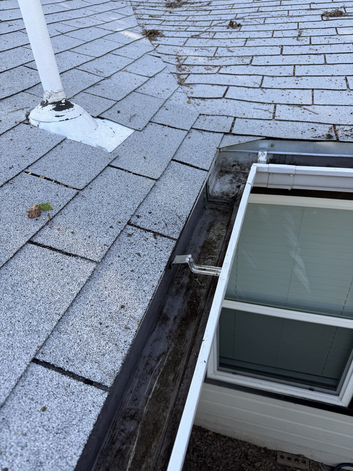 Same gutter completely clean and flowing after gutter cleaning service