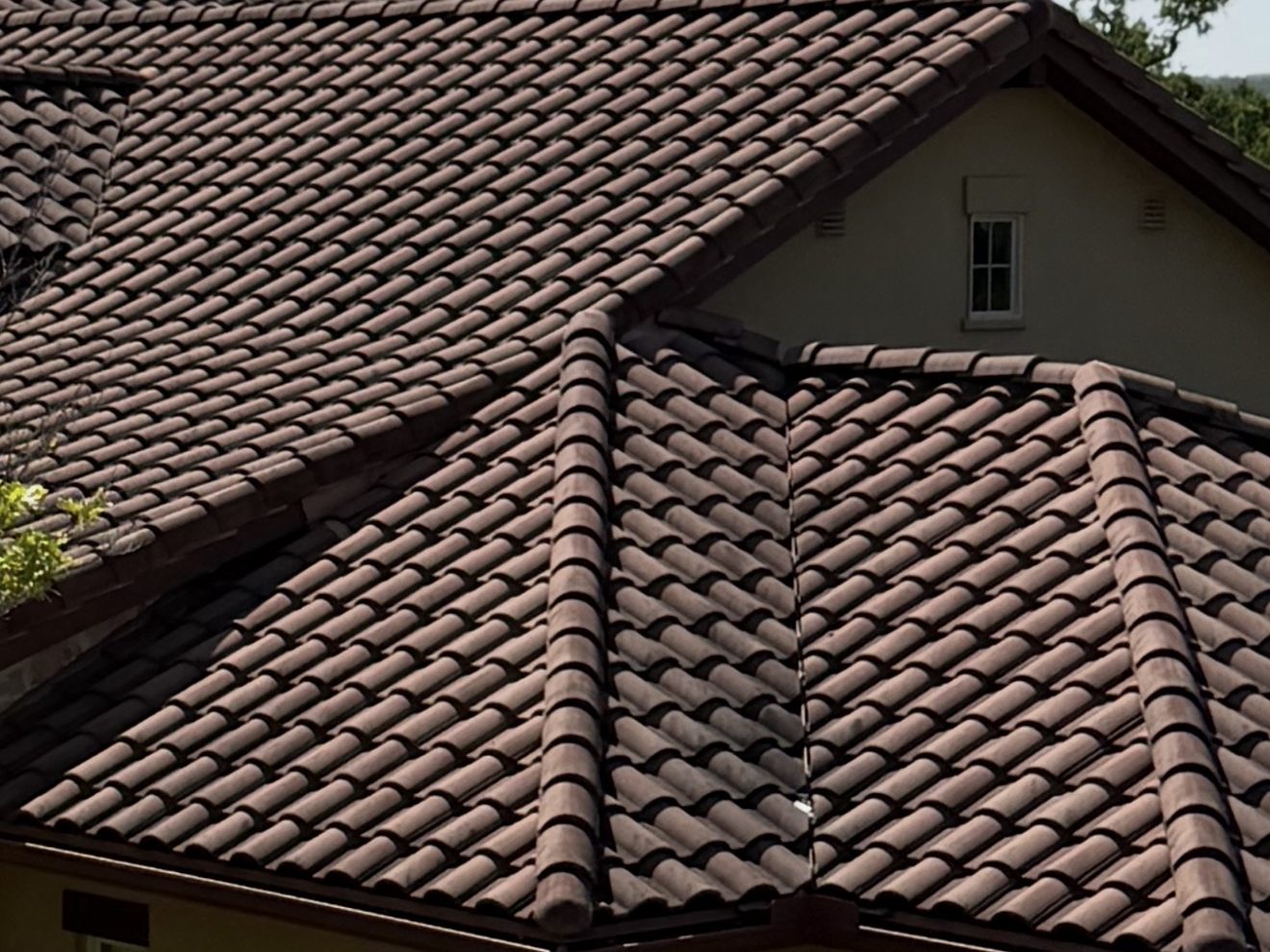 Clean tile roof on a Hill Country home after professional roof soft washing
