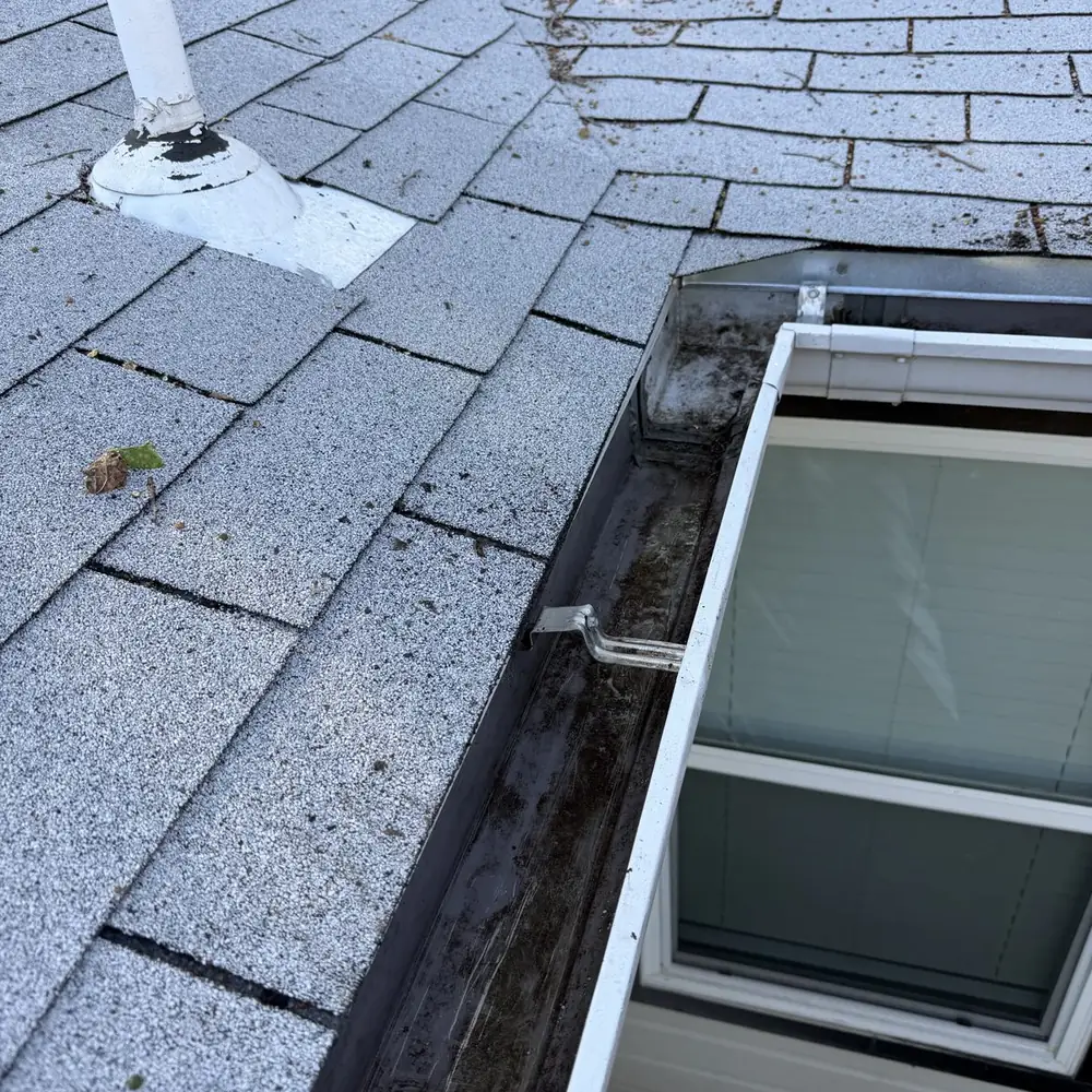 Same gutter completely clean and flowing after gutter cleaning service