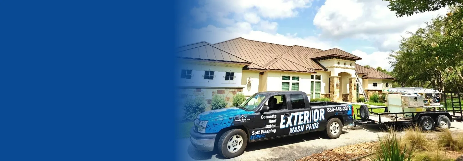 Exterior Wash Pros truck and pressure washing trailer in front of a Texas Hill Country home