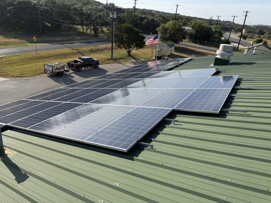 Rooftop solar panels gleaming after professional solar panel cleaning in the Texas Hill Country